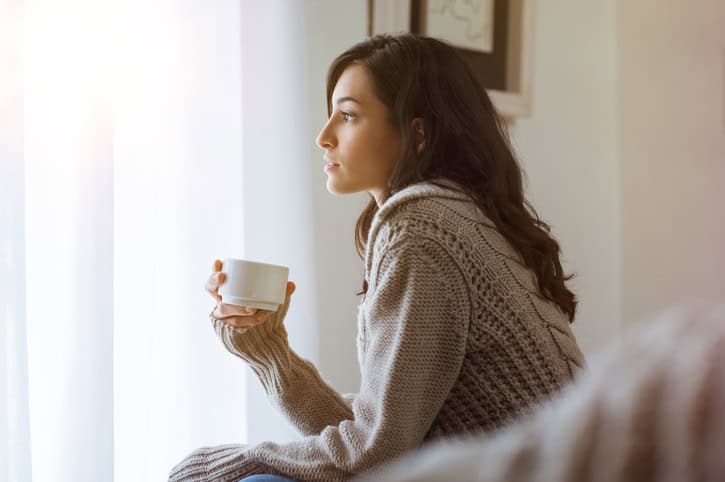 Woman thinking at home