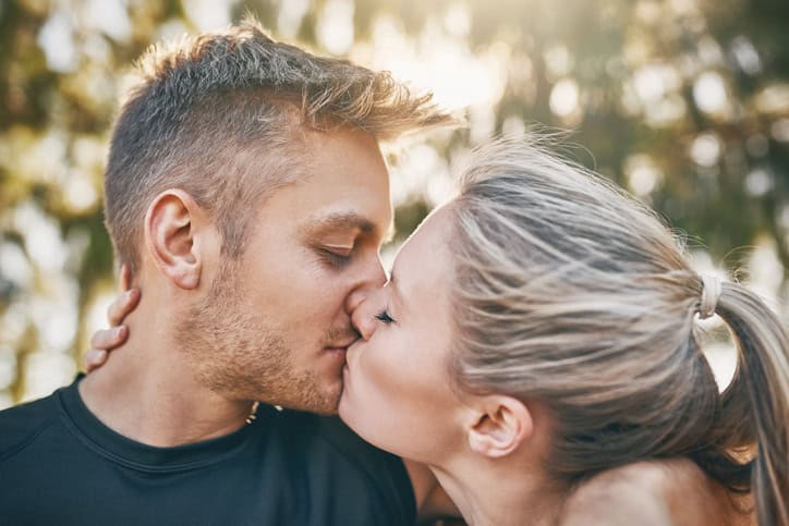 Shot of a young couple kissing outdoors