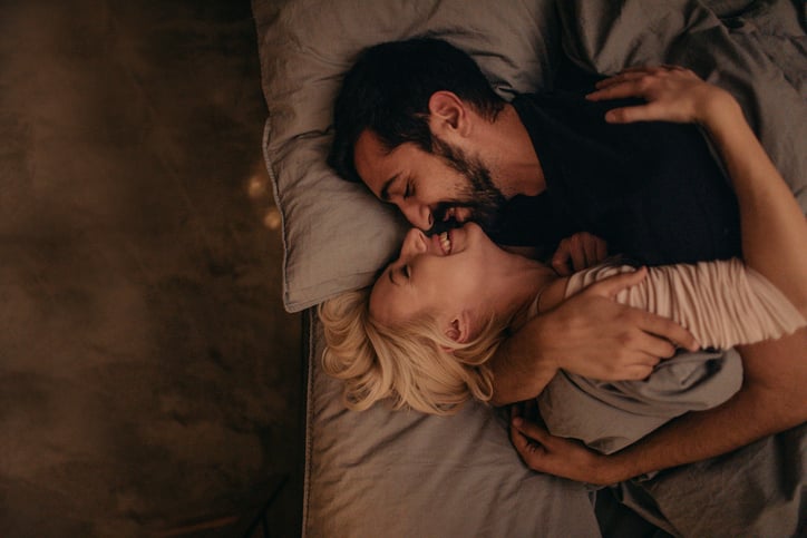 Portrait of a couple in love, sharing their love and affection in the privacy of their bedroom