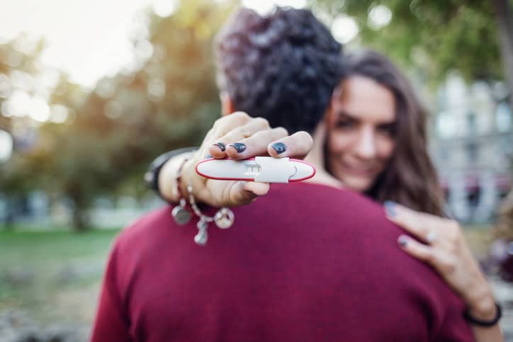 Couple proudly shows positive pregnancy test