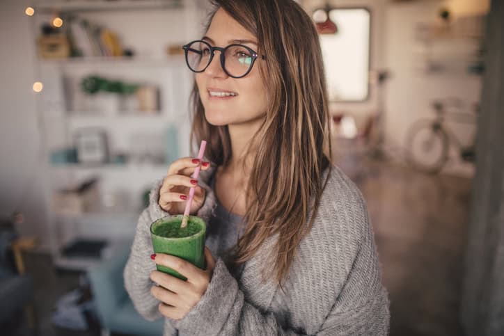 Woman drinking a smoothie.
