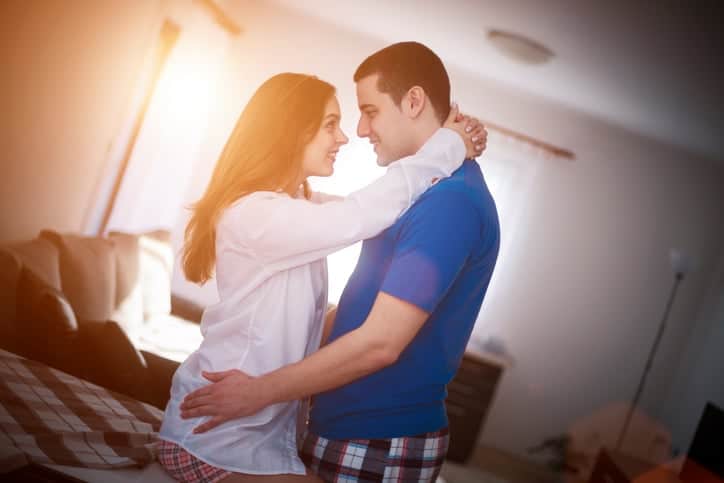 Lovely couple in pyjamas spending Valentine's day at home