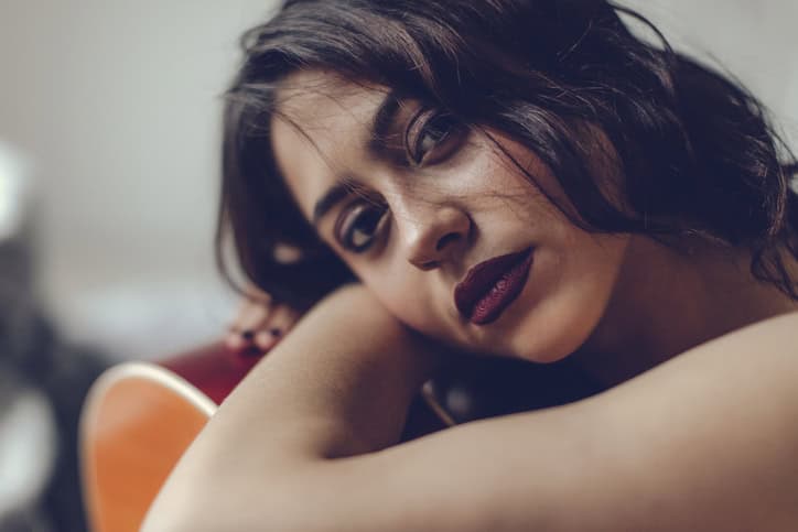 Young woman in bedroom
