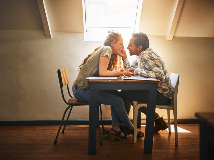 Shot of a young couple spending time together at a cafe