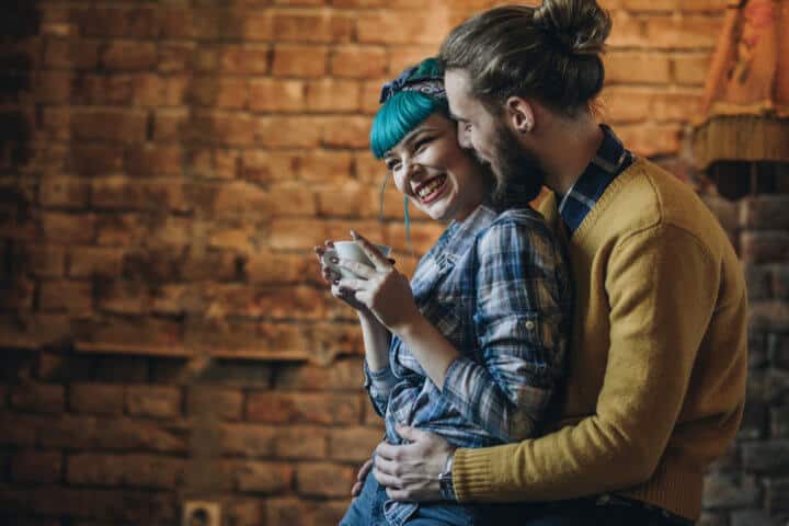 Happy couple enjoying in their love in a cafe.