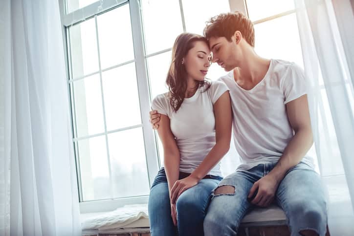 Couple in bedroom.