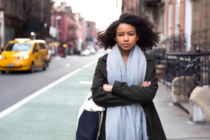 Successful and elegant woman walks the streets of New York, USA.