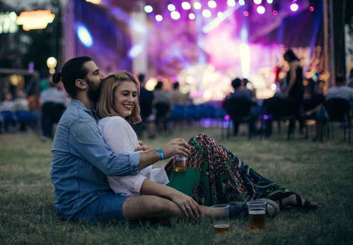 Couple at an outdoor concert.