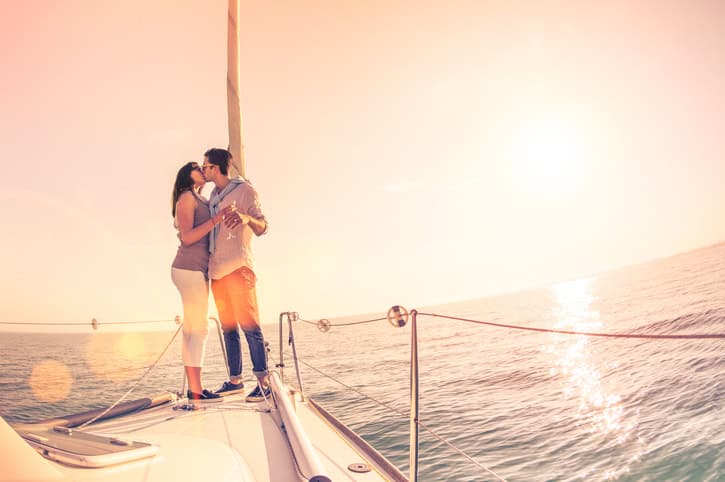 couple kissing on a boat