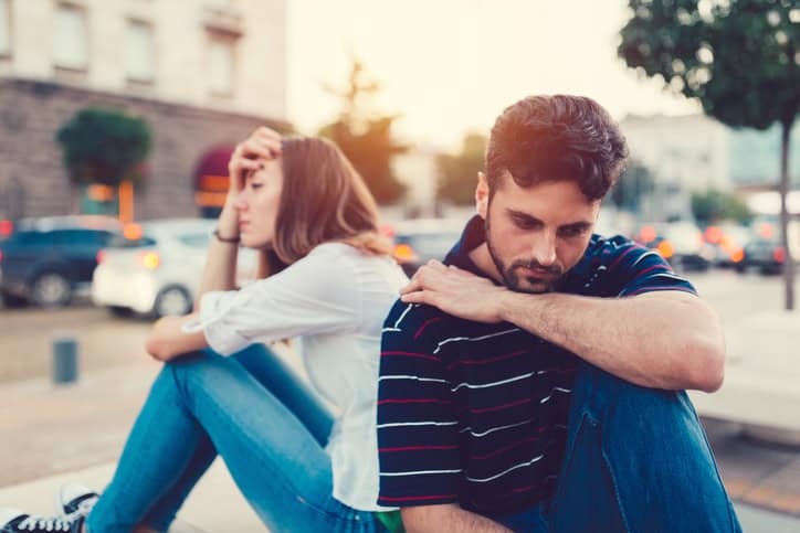 Young woman ignoring her boyfriend