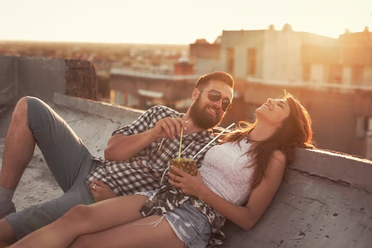 Couple enjoying summertime rooftop party