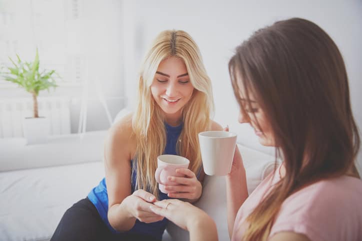 Woman having coffee together at home.