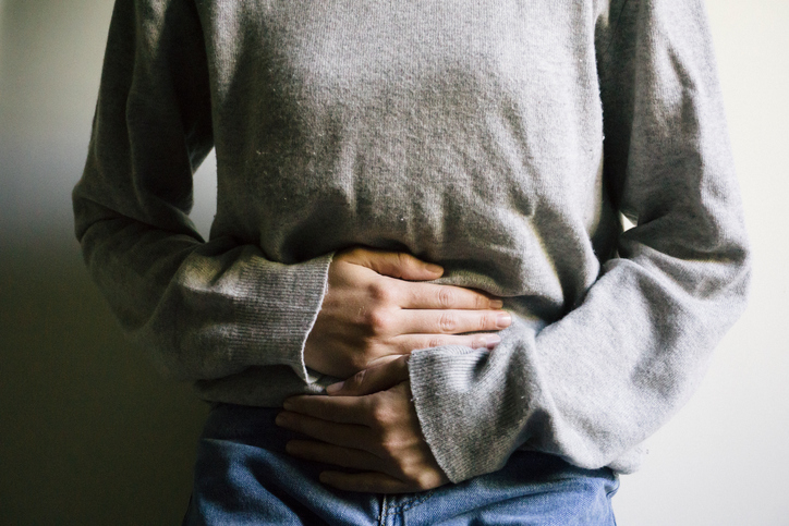 Woman suffering from a stomach ache.