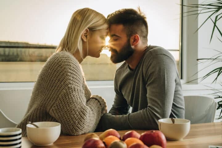 romantic couple touching foreheads