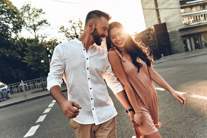 young couple walking in the street