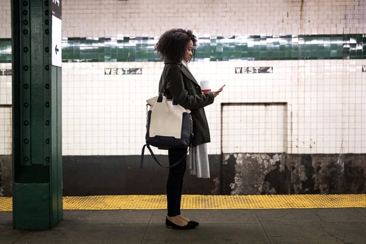 african american woman standing on platform