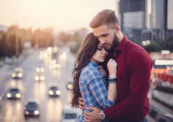 Young couple emracing outside