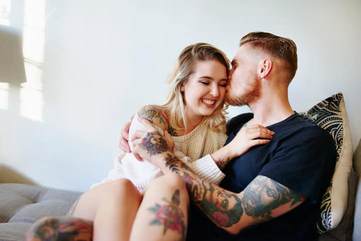 couple kissing together