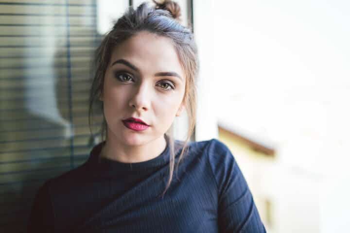 Portrait of young caucasian woman indoor.