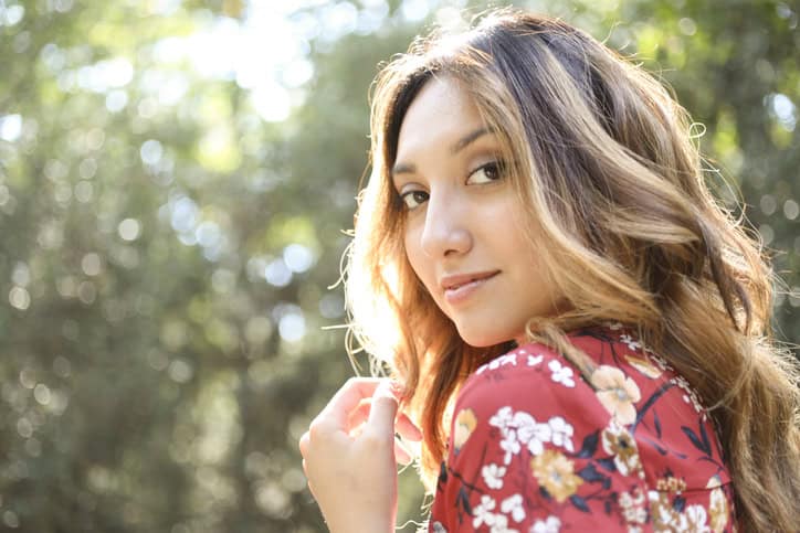 Portrait of beautiful Latin woman outdoors.