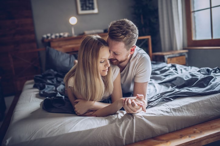 couple being intimate in the bedroom