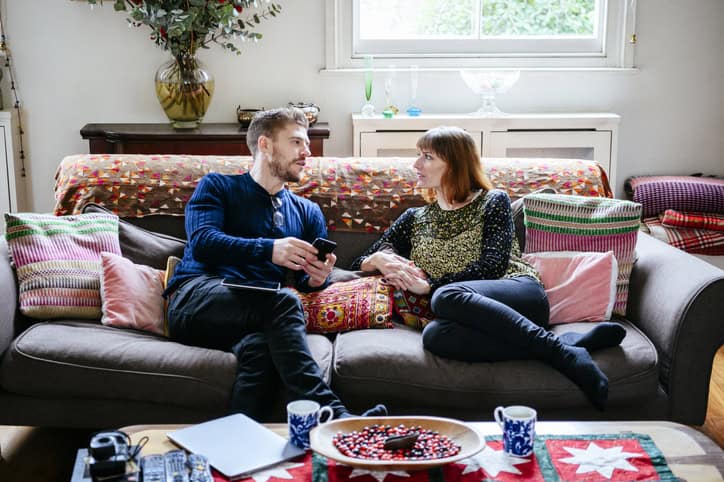 couple sitting at home chatting