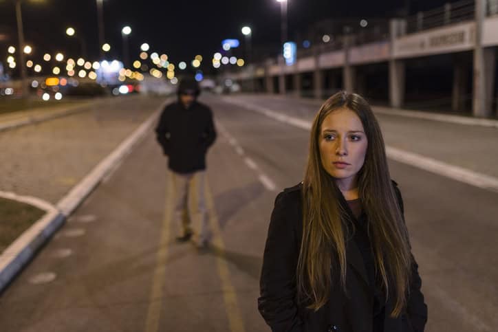 A woman being stalked on the street.