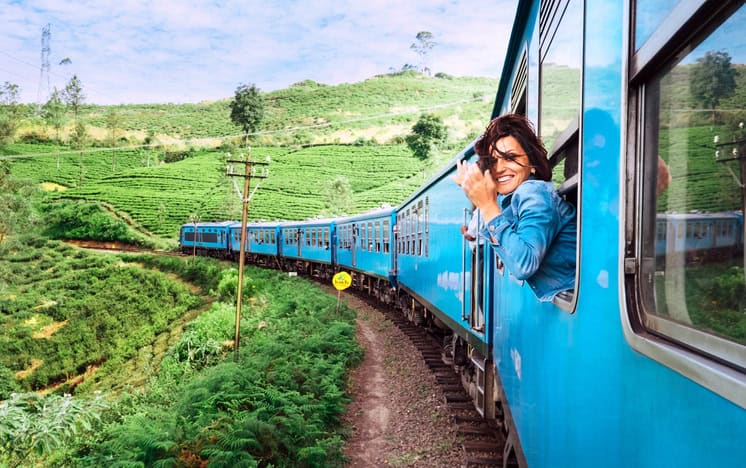 woman looking out of a moving train