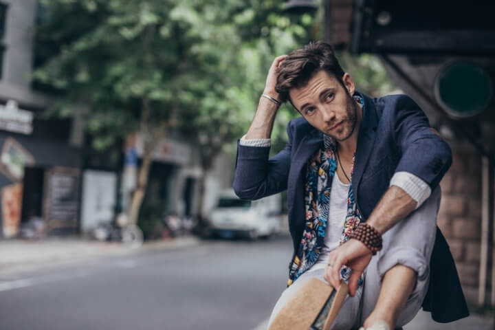 One man, handsome modern young man on the city street.