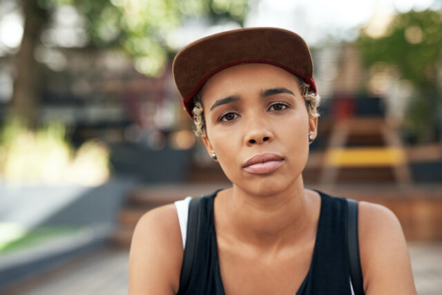 portrait of a young serious girl outside