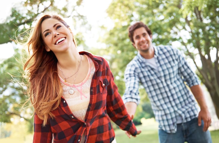 couple in plaid laughing and smiling together
