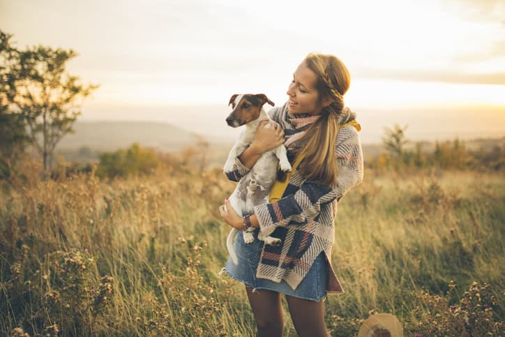 woman dog field