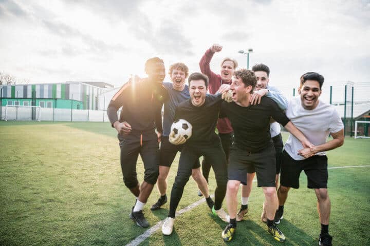 bunch of guys playing football