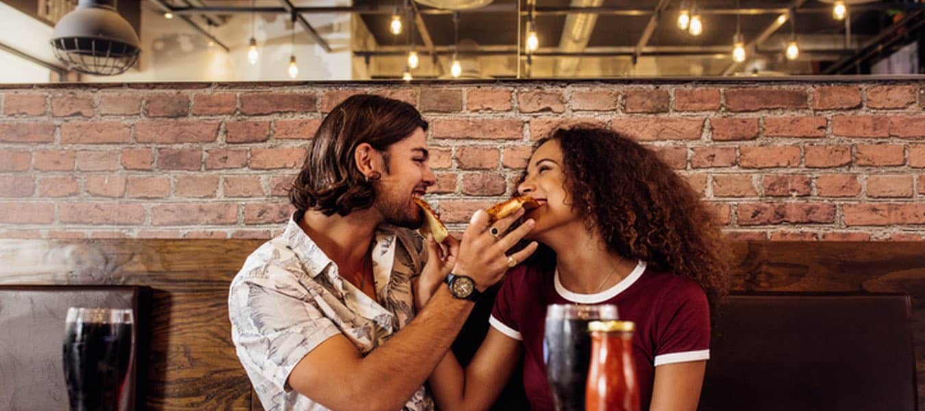 couple feeding each other