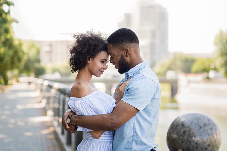 african-american couple embracing outside
