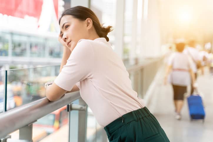 Sad woman standing in the city