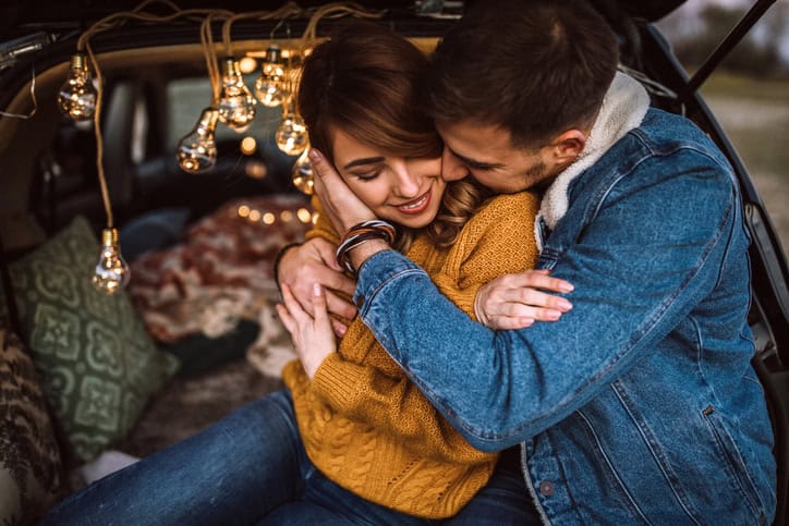 Couple hugging one another. 