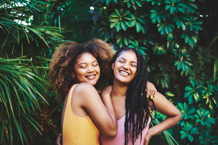 Two confident young women on vacation together.