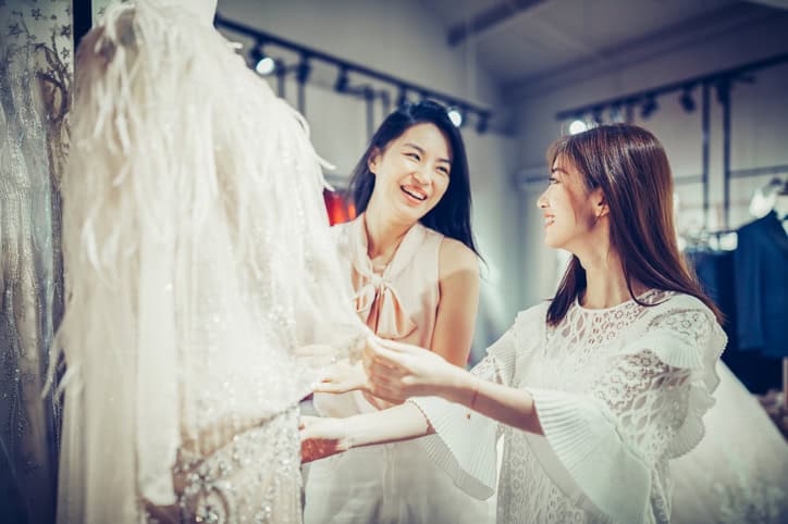 best friend at bridal shop