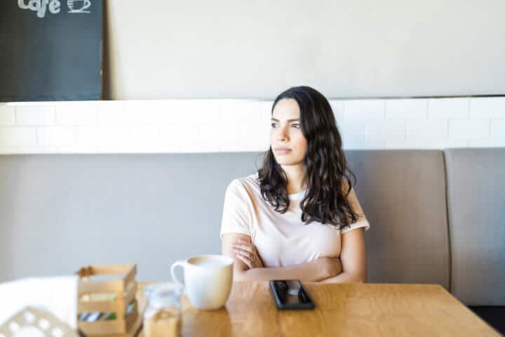 woman sitting alone in cafe