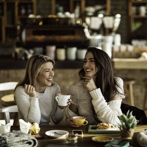 women at a coffee bar