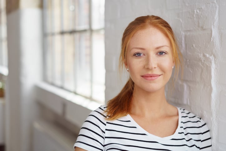 red headed woman in striped t-shirt