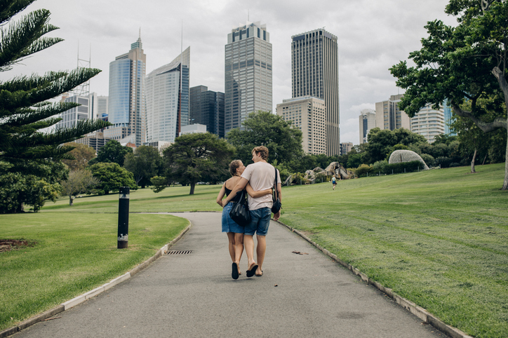 Young couple taking a romantic walk through Sydney.