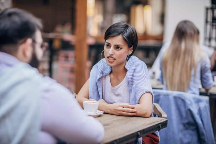 young couple having a discussion outside