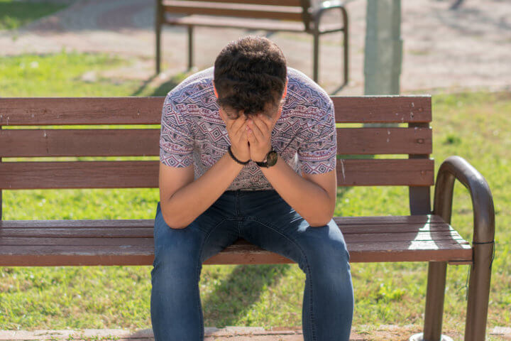 man with his head in his hands