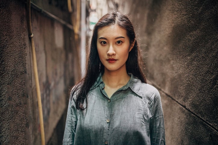 long haired asian woman facing camera