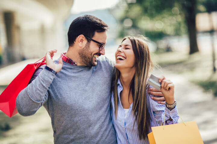 couple outside looking happy and smiling