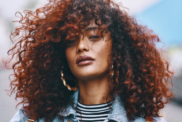 curly haired african american woman serious