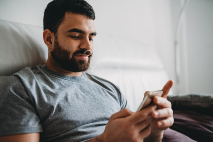 man looking at his smartphone