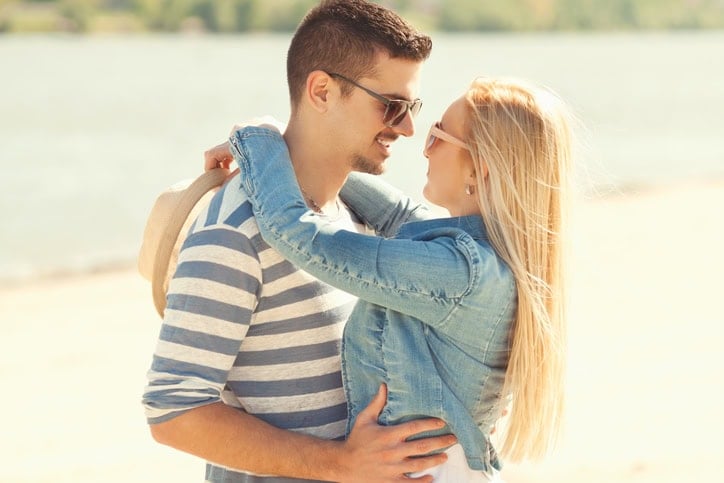 couple kissing on the beach